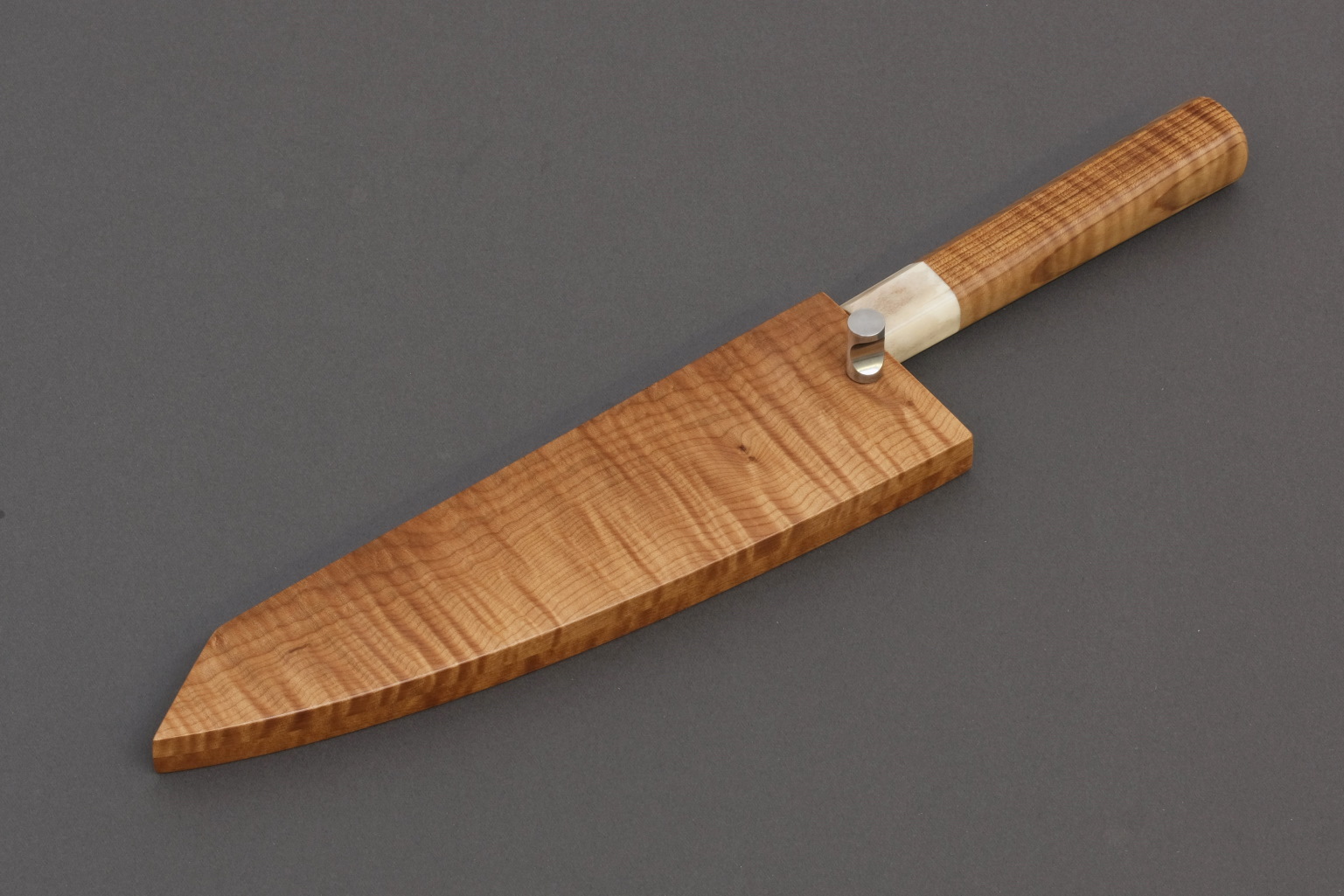 Nakama knife from Guldimann with a handle and sheath from Bijouwood flamed maple