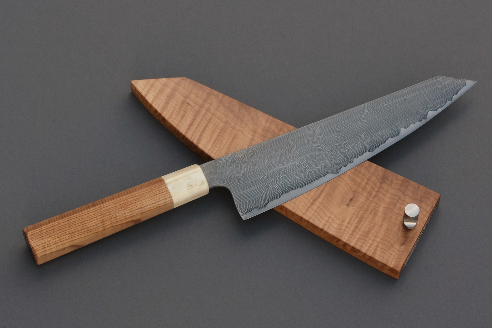 Nakama knife from Guldimann with a handle and sheath from Bijouwood flamed maple