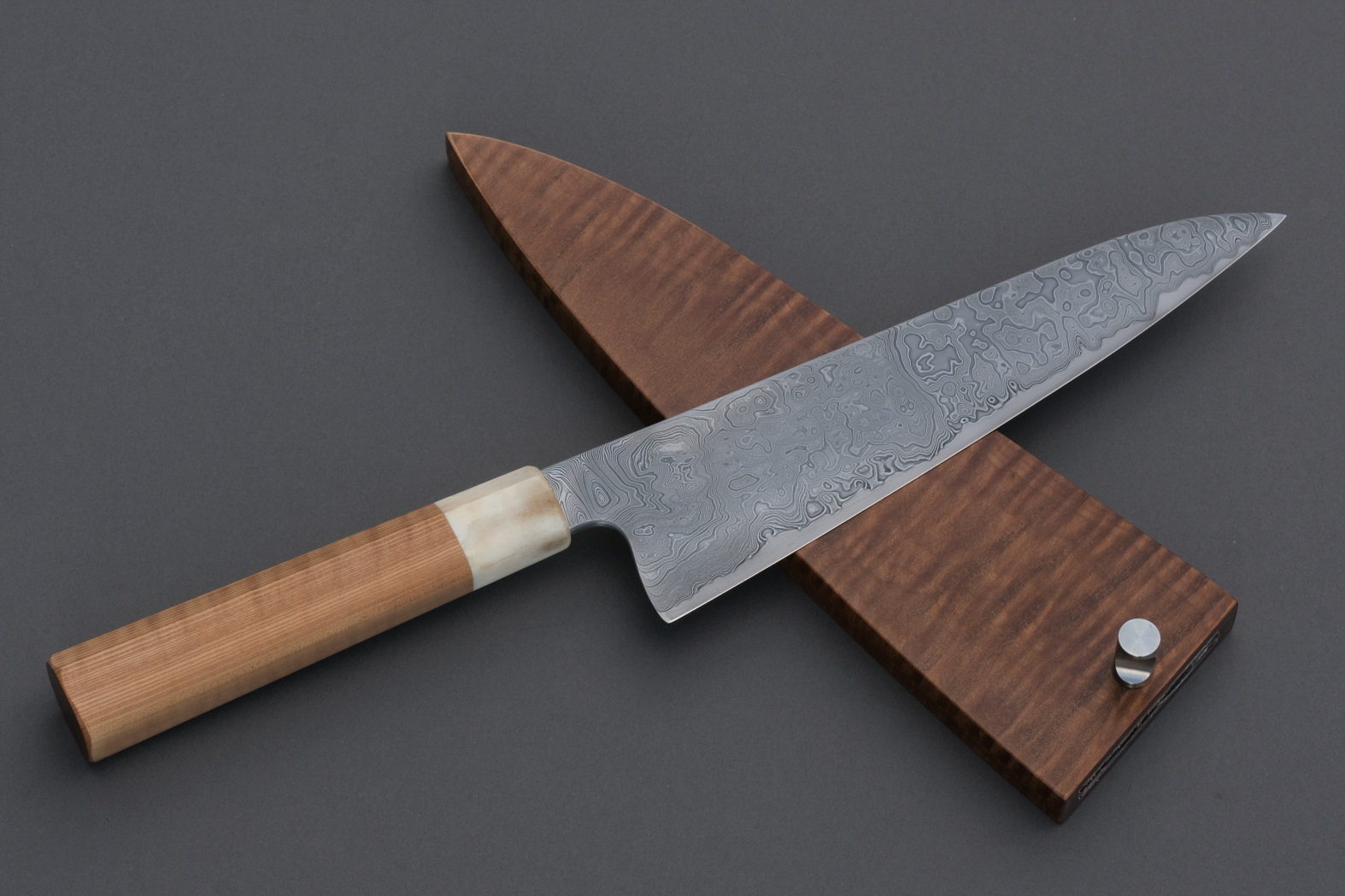 Nakama knife from Guldimann with a handle and sheath from Bijouwood flamed maple